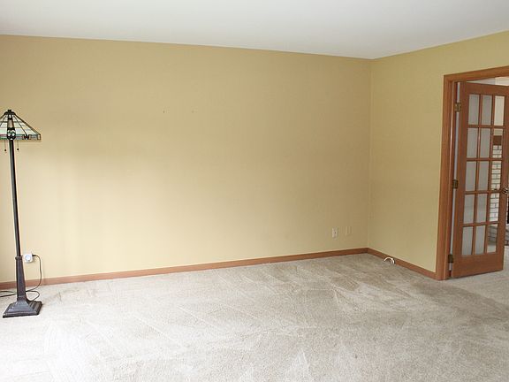 Formal Living Room with French doors to Family Room!