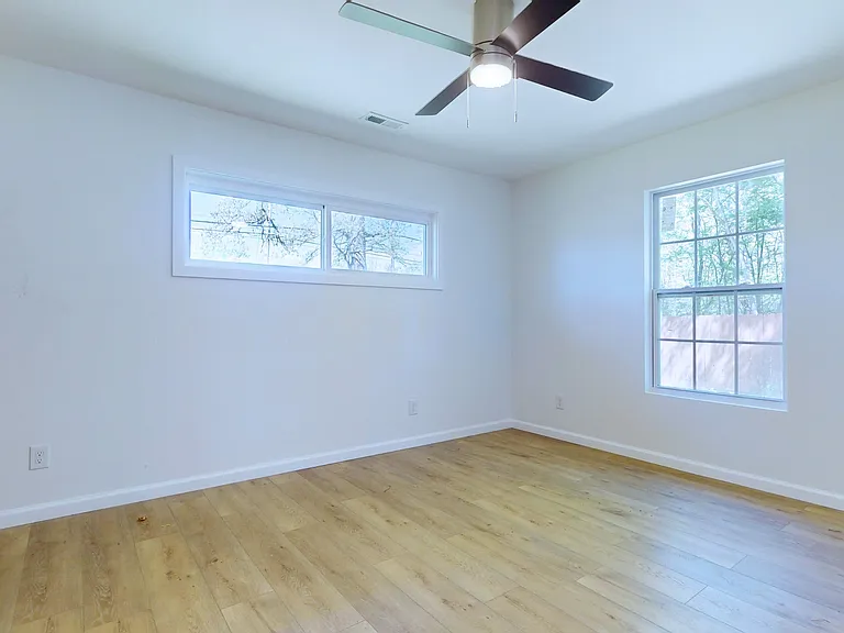 Bedroom 2 - This bedroom has a ceiling fan and a large reach-in closet.