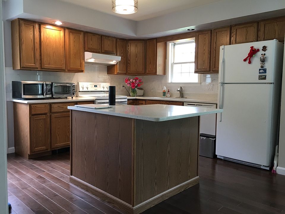 Newly renovated kitchen with new hardwood floors, quartz cou