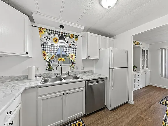 Kitchen updated with new cabinets and count tops, and sink. New flooring,
Dishwasher and Refrigerator
