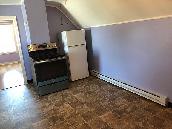 Kitchen with new electric stove and refrigerator and new ele