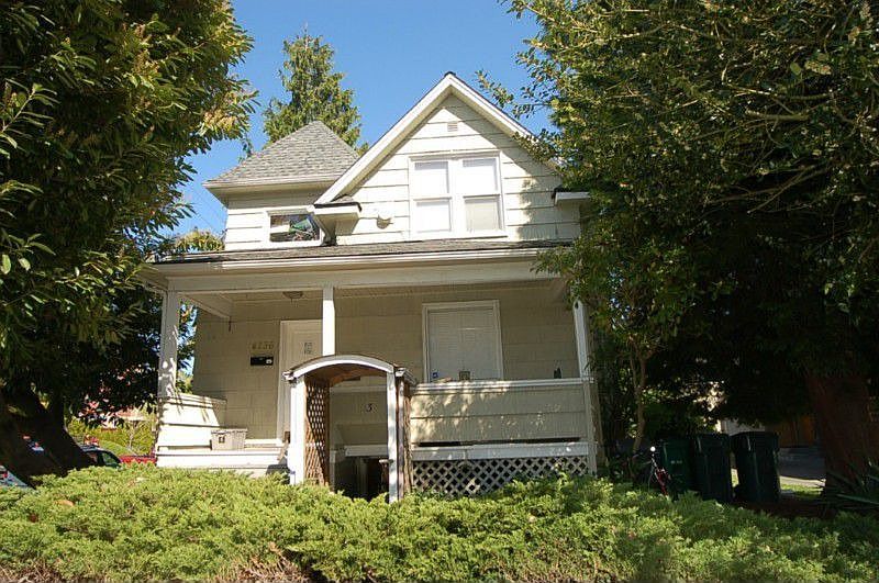 Handsome Tri-Plex sits on a corner lot. Driveway is to the right of the tree and garage sits back off the street allowing room for 2 parker cars outside 1 inside. Lots of parking open to tenants next to house.