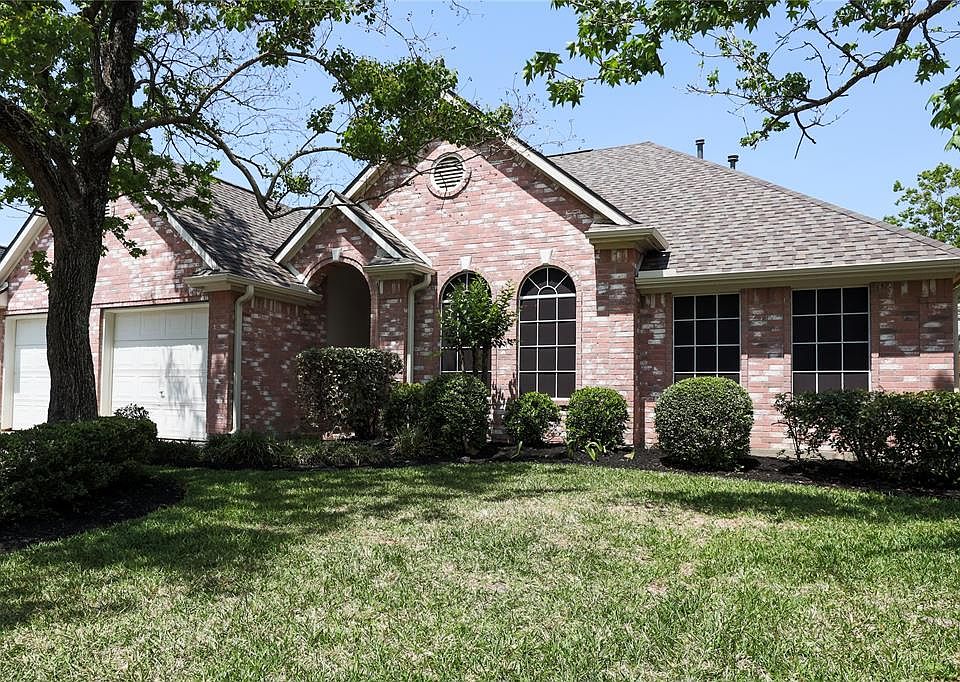 Beautiful elevation with solar screens, recent roof, and nice landscape