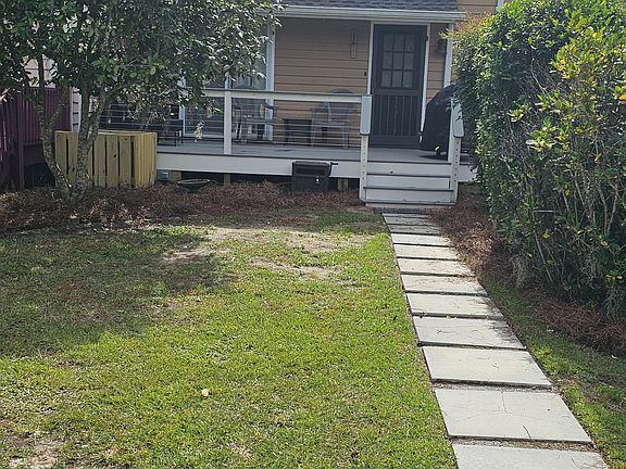 Entry from Parking Lot into House-Beautiful Blooming Camlelia 2 times per year