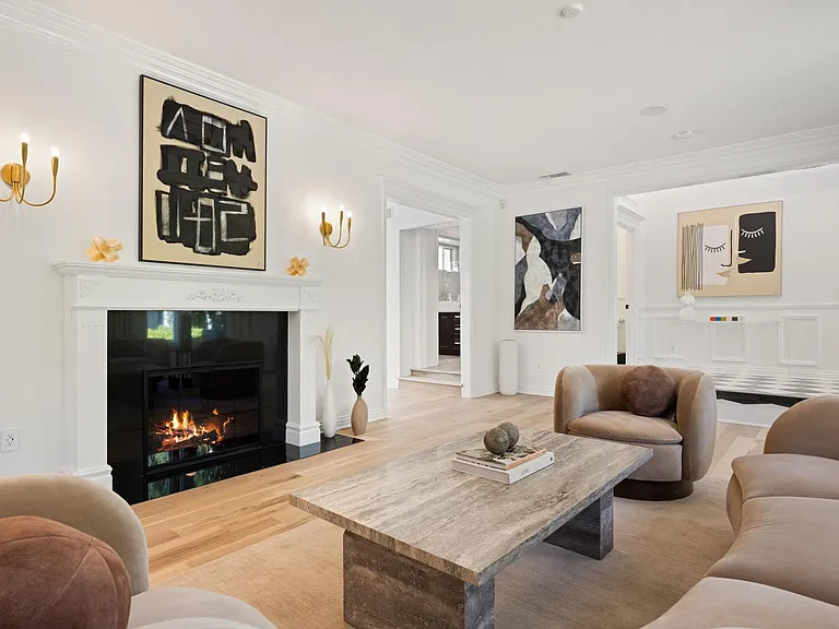 The living room fireplace invites warmth and comfort for moments of pure relaxation.