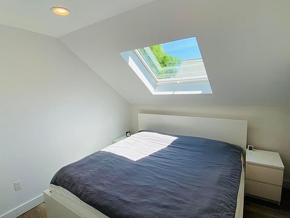 Bedroom with skylight shade open