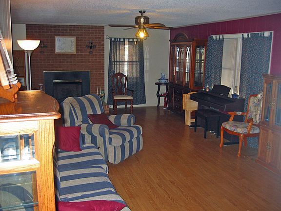 Large Living Room With Laminate Wood Floors And Gas Log Fire Place With Remote