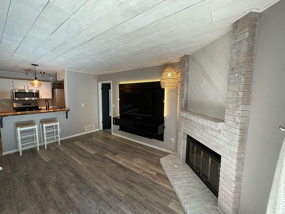 Living room area, shiplap ceilings *comes with floating entertainment center