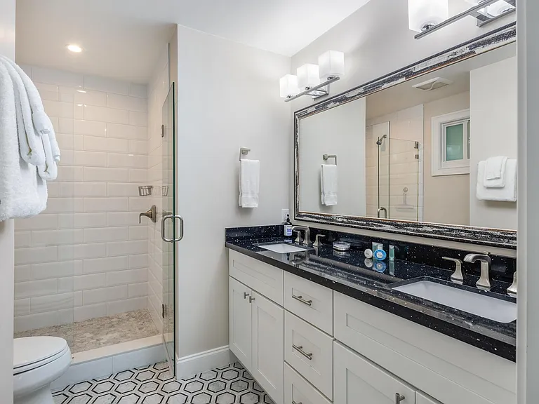 Bathroom- Walk in shower, his and hers sinks, towels provided