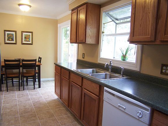 Great updated kitchen with compatible color scheme and Tiled Floors