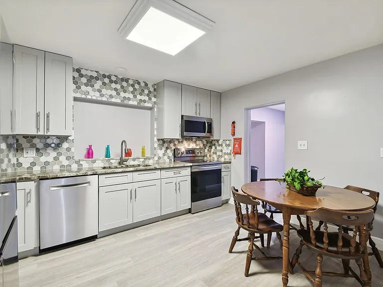 Totally updated kitchen with granite counter tops, stainless steel appliances and plenty of custom cabinets.