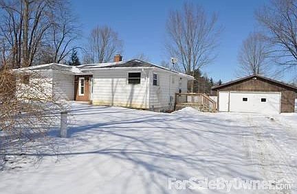 Driveway view of the house & garage