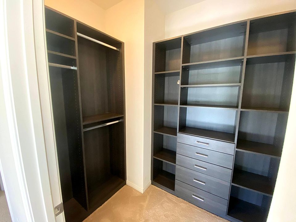 Master bedroom closet. Customized walk-in closet built by California Closets