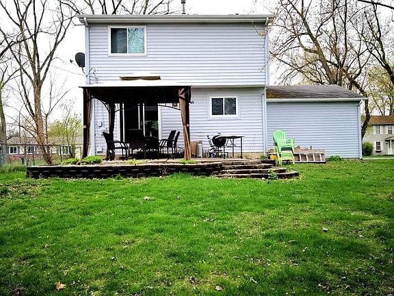 large patio with gazeb, firepit and lot of space in the back for entertaining