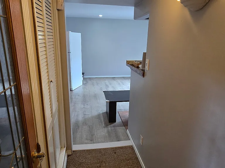 Hallway leading to lower den/wet bar area