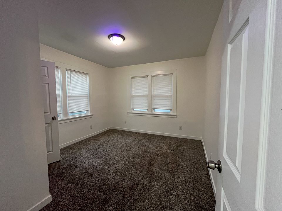 Recently carpeted bedroom with new windows for ample sunlight