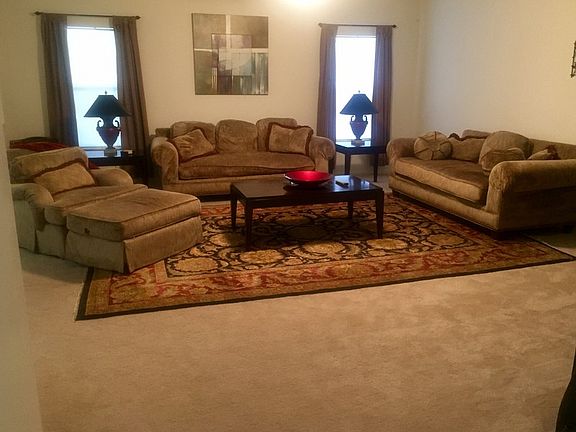 Family Room
						:
						Great for entertaining and watching football.