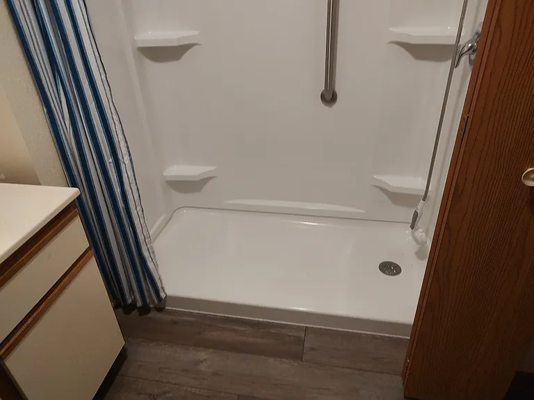 Bath with step-in shower