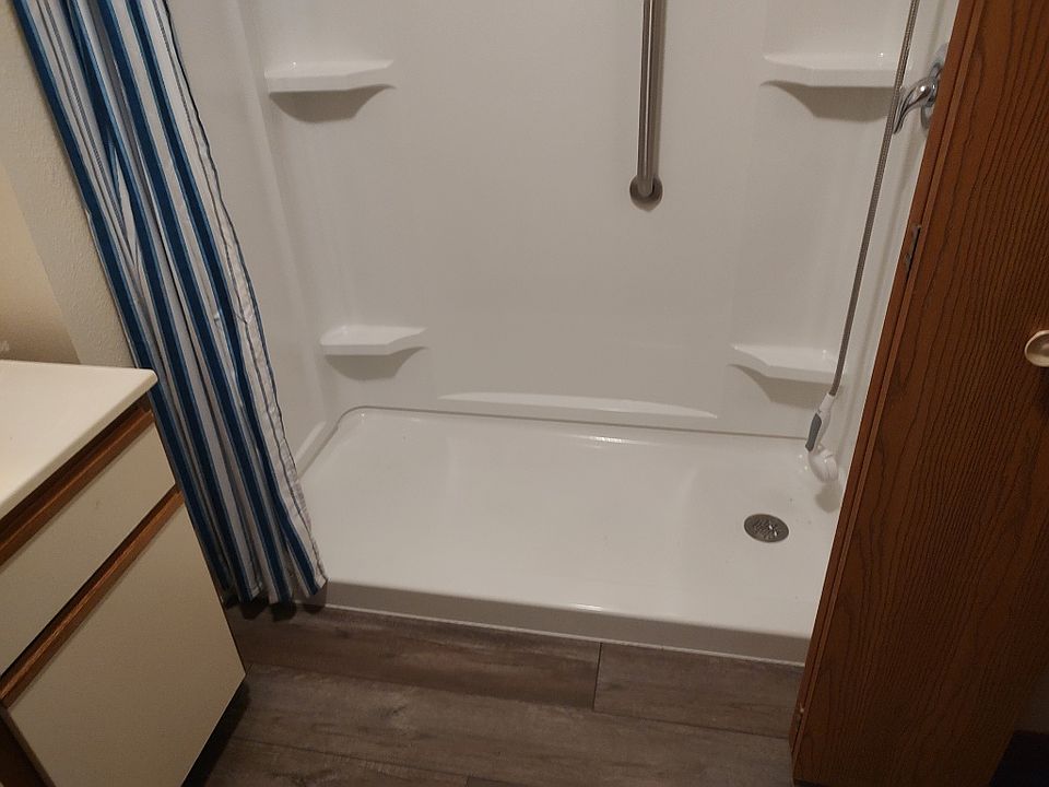 Bath with step-in shower