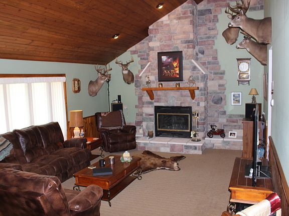 Living room with vaulted ceiling.