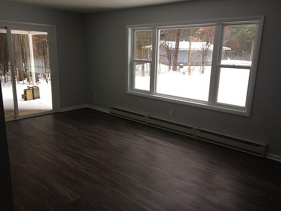 Living room with sliding door to covered deck
