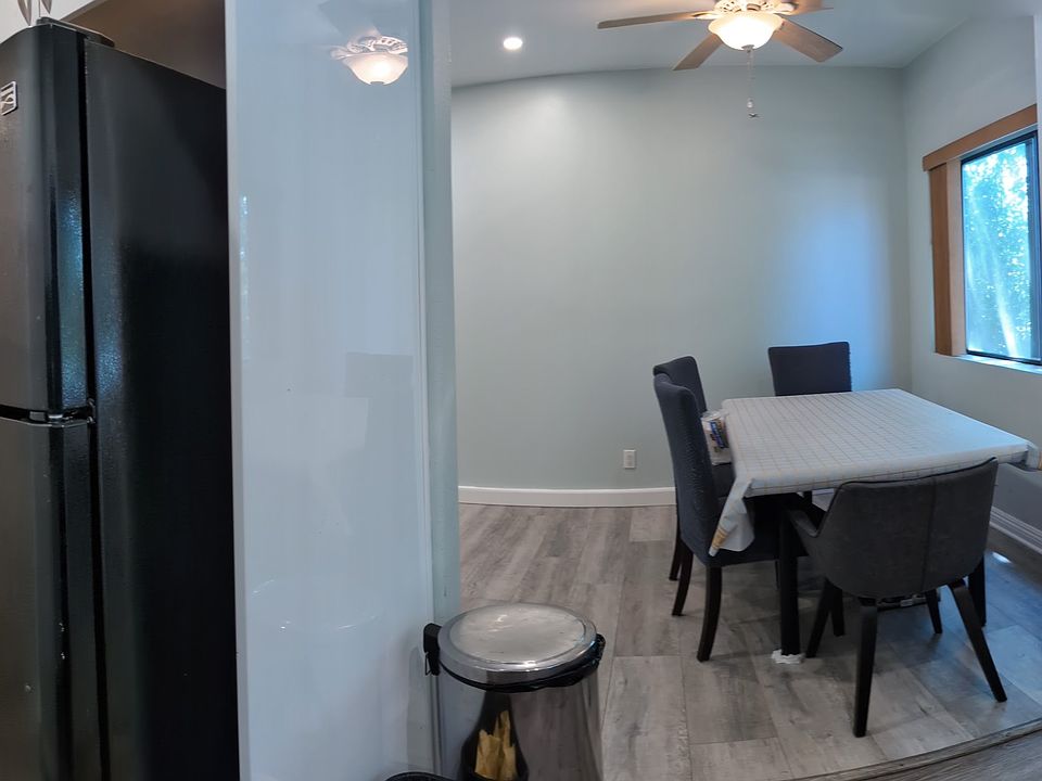 Panorama with entry door on the left and dishwasher on the right.