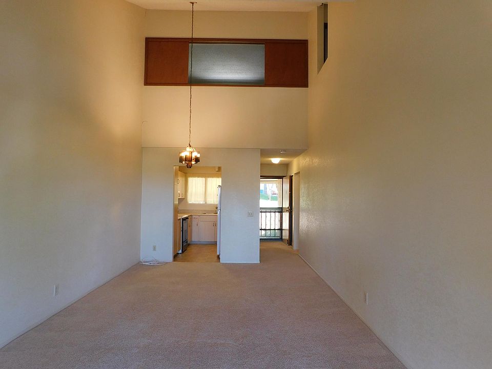 View from the lanai. High-ceiling. Master bedroom/bath suite upstairs overlooks living/dining area.
