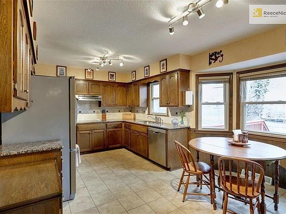 Bright & sunny updated Eat-In Kitchen.  Enjoy your morning coffee looking out to deck & yard!