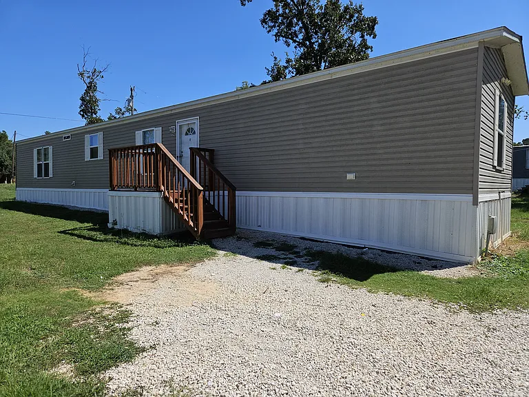 Front entrance of mobile home. It is the home in the back.