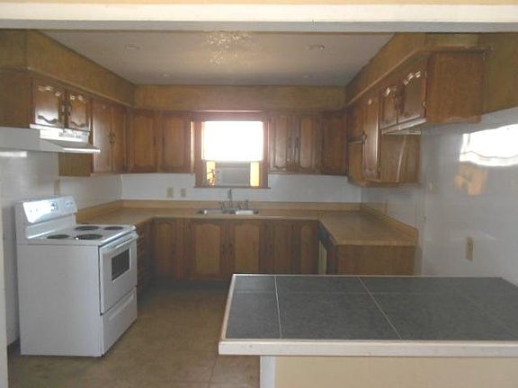 Kitchen, electric stove, range hood, dishwasher, disposal, b
