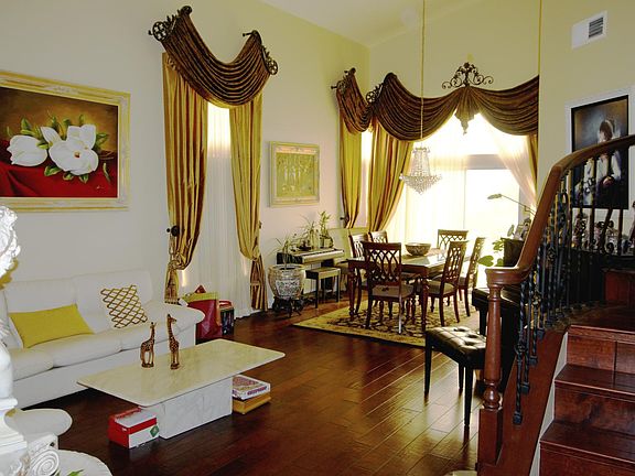 cathedral ceiling with beautiful wood flooring.