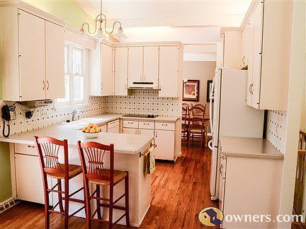 Open kitchen with lots of cabinet storage room
