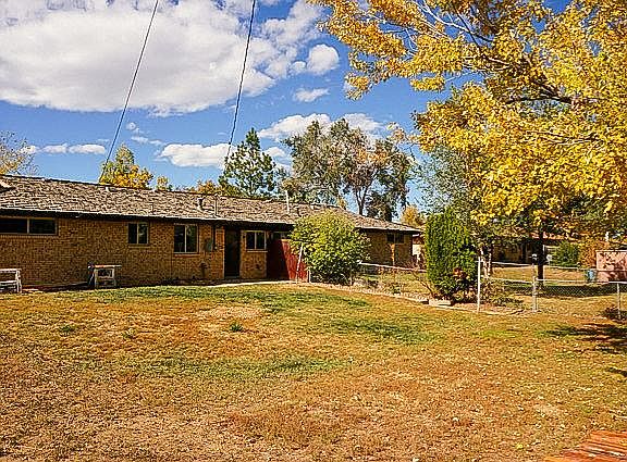 Spacious fenced backyard, includes doggie door for easy pet access.