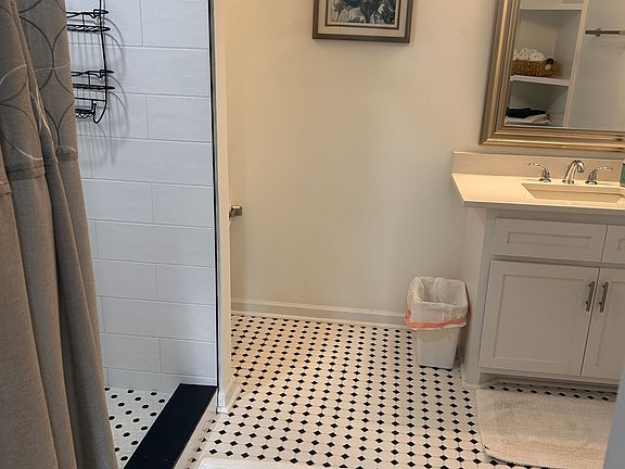 Spacious and updated tiled Master bathroom.