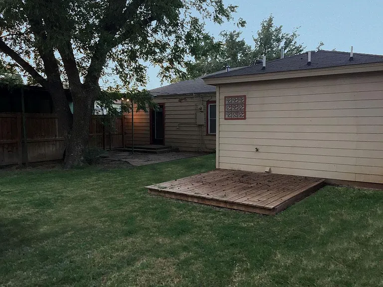 backyard deck and shade tree
