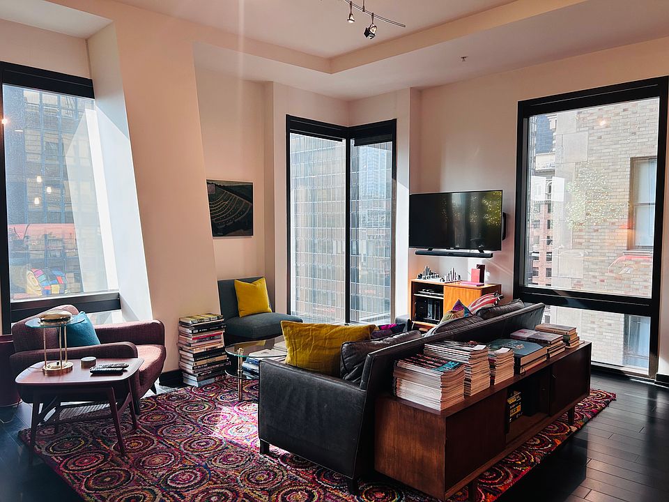 Livingroom with floor to ceiling windows with views of DTLA.