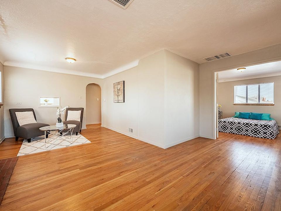 Living room and french doors to first bedroom
