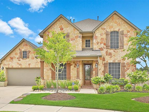 The garage is oversize and the garage floor has been upgraded to race deck tiles.