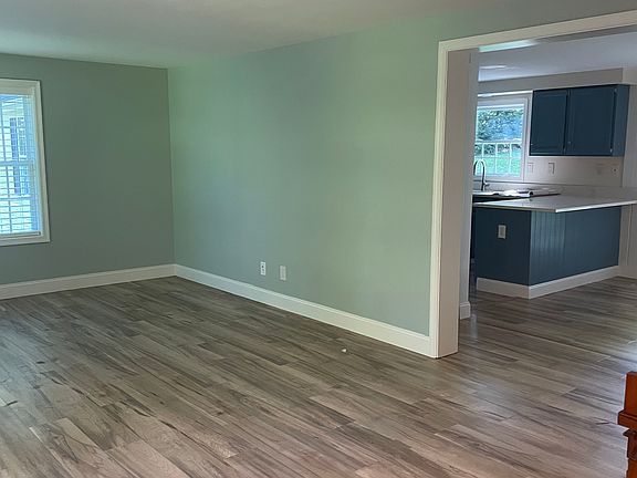 Bright open living area adjacent to kitchen/dining area