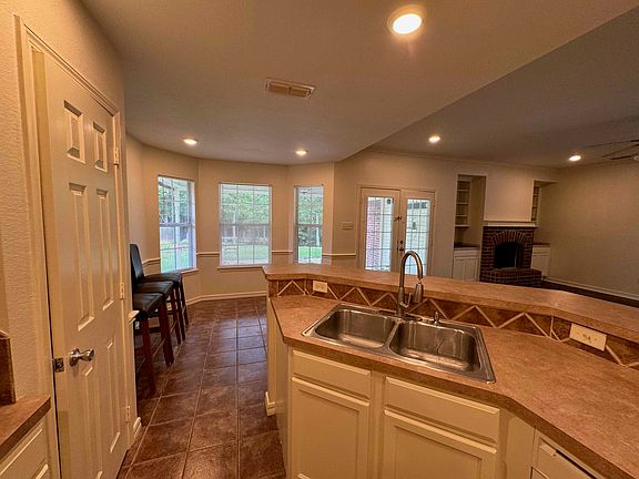Kitchen looking toward bay windows of the breakfast room.