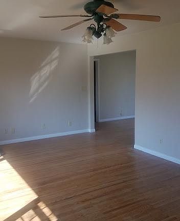 Living Room w/ ceiling fan & Hardwood floors