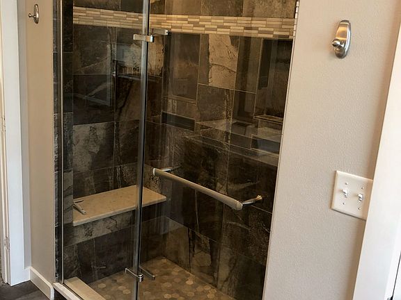 Slate tiled shower w/ seat