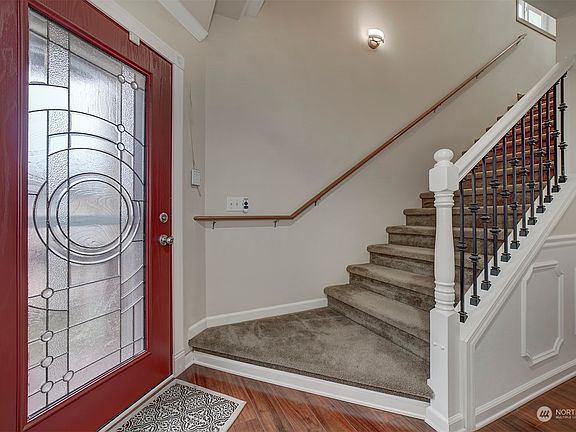 Front entrance w/ open railing stairs.>