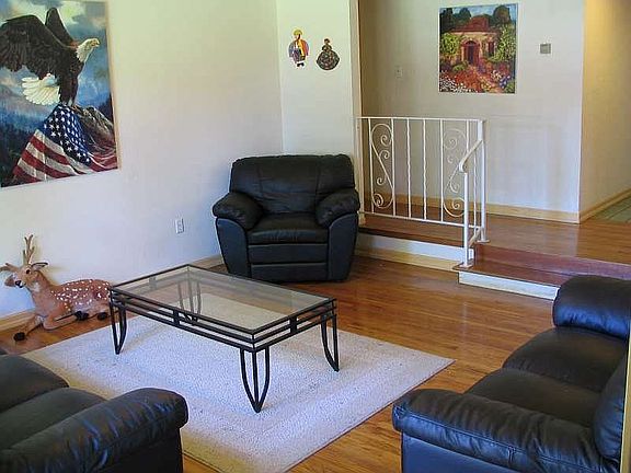 Gleaming Hardwood Floors in Step Down Living Room & Hall