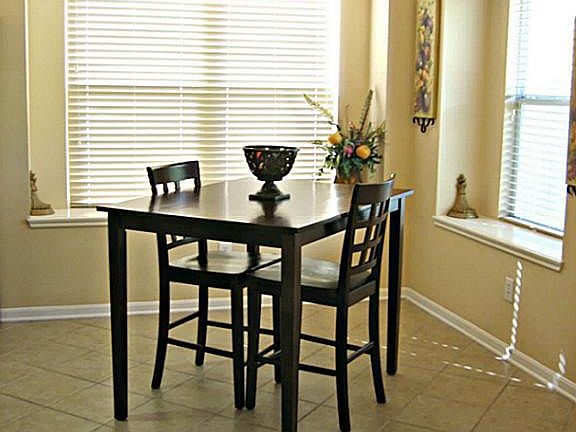 Bright dining area open to kitchen and living room. Great for entertaining.