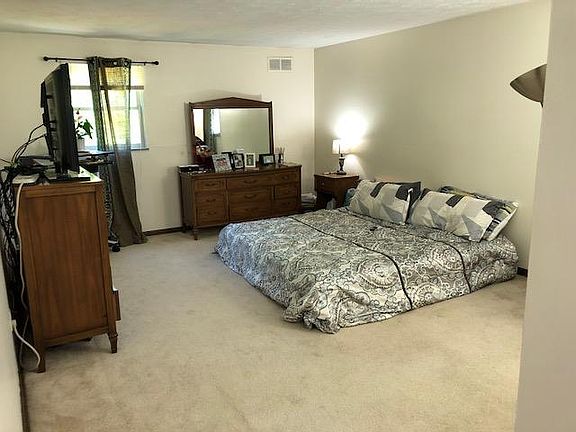 master bedroom with private bathroom and shower
