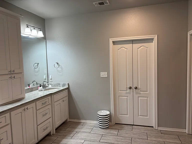 Master restroom from walk in closet