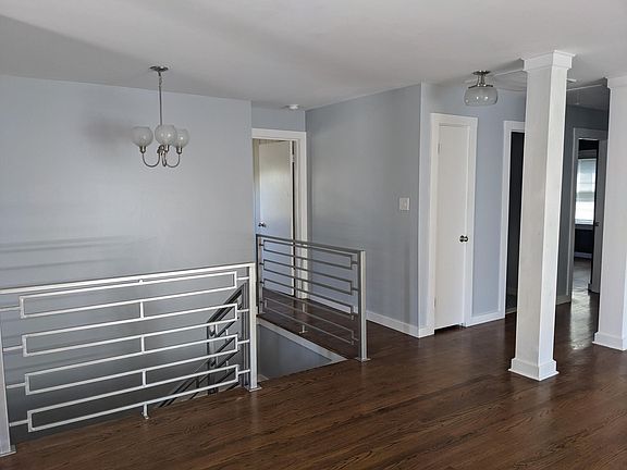 Stairs to finished basement. Door to third bedroom adjacent to stairs.
