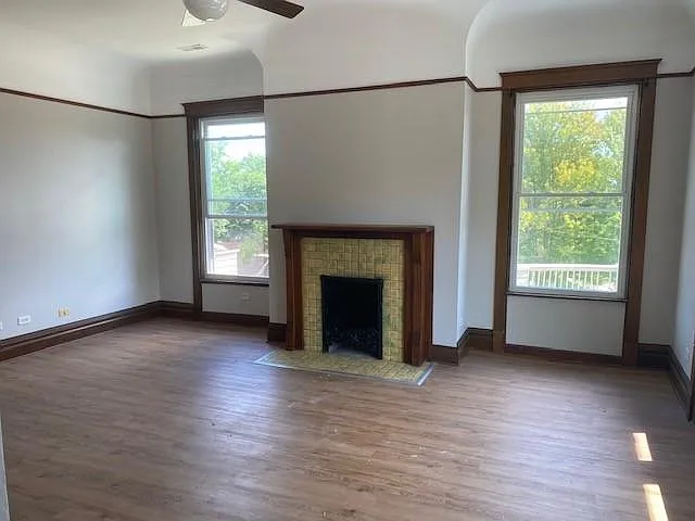 Living Room with gorgeous fireplace (non working) and high curved ceilings