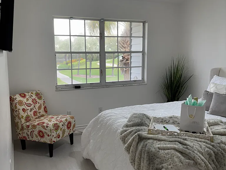 Master bedroom with view of the golf course and lake